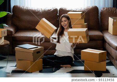 Image of Young asian woman startup freelance with parcel box. Online marketing packing box delivery concept. 93113458