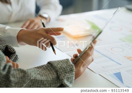 Fund managers team consultation and discuss about analysis Investment stock market by digital tablet. Fund managers team consultation and discuss about analysis Investment stock market by digital tablet. 93113549