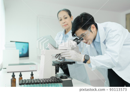 Group of science researchers working with test tube medical science laboratory Group of science researchers working with test tube medical science laboratory 93113573