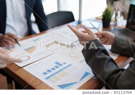 Group of coworkers having a meeting and working together in boardroom Group of coworkers having a meeting and working together in boardroom 93113704