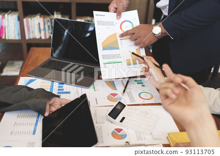 Group of coworkers having a meeting and working together in boardroom Group of coworkers having a meeting and working together in boardroom 93113705