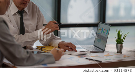 Administration or Accountant discussing with partner are meeting to audit finance planning sales to meet targets set in next year. Finance concept. 93114878