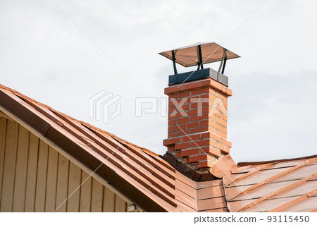 Red brick chimney with a metal roof 93115450