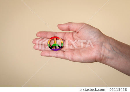Peace sign in hands in rainbow colors. The concept of diversity and inclusion. LGBT. 93115458