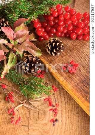 branches of holly, pine cones, mountain ash berries 93117687