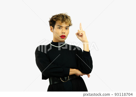 young asian gay in a black dress pointing something. Transgender person on white color background. LGBTQ+ concept. 93118704