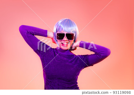 Cyber punk girl concept, happy asian woman in purple sweatshirt wearing sunglasses posing like robot. isolated on red color background. Cyber punk girl concept, happy asian woman in purple sweatshirt wearing sunglasses posing like robot. isolated on red color background. 93119098