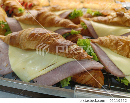 Closeup. Croissant with ham and cheese on tray. Closeup. Croissant with ham and cheese on tray. 93119352