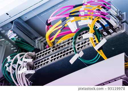 Fiber Optic cables connected to an optic ports - data switch in internet data center Fiber Optic cables connected to an optic ports - data switch in internet data center 93119978