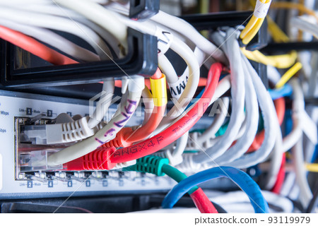 various ethernet cables plugged in network switch various ethernet cables plugged in network switch 93119979