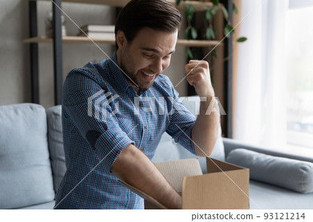 Man opens parcel box with long-awaited goods feels overjoyed 93121214