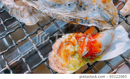 Grilled oysters arranged in Italian style 93122065