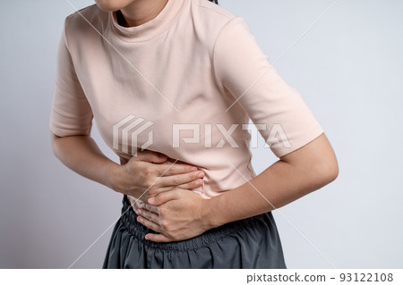 Asian woman was sick with stomach ache standing isolated on white background. Asian woman was sick with stomach ache standing isolated on white background. 93122108