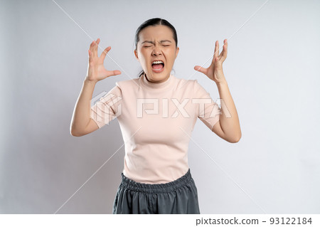 Asian woman angry and shouting isolated on background. 93122184