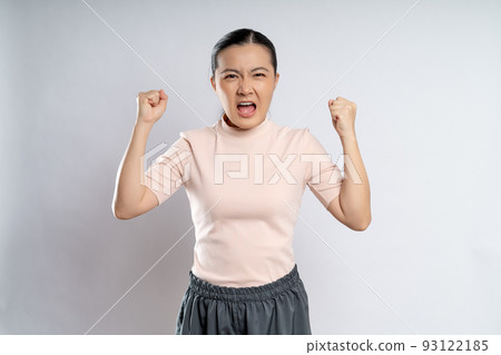 Asian woman angry and shouting isolated on background. Asian woman angry and shouting isolated on background. 93122185