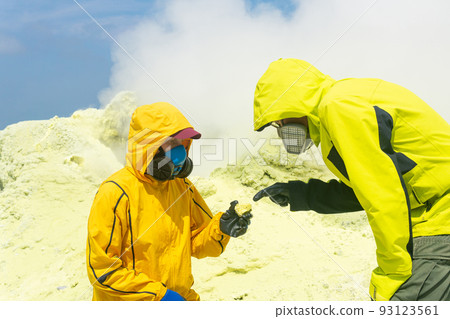 volcanologists on the slope of the volcano study samples of minerals against the backdrop of smoking sulfur fumaroles volcanologists on the slope of the volcano study samples of minerals against the backdrop of smoking sulfur fumaroles 93123561