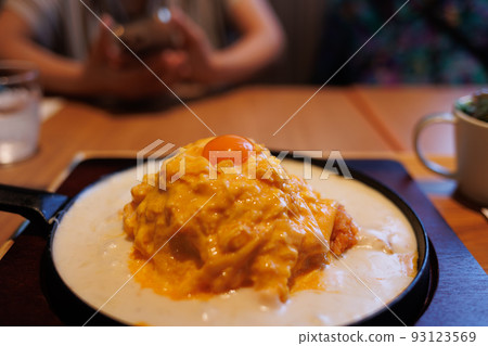 Creamy egg omelet rice topped with raw egg Creamy egg omelet rice topped with raw egg 93123569