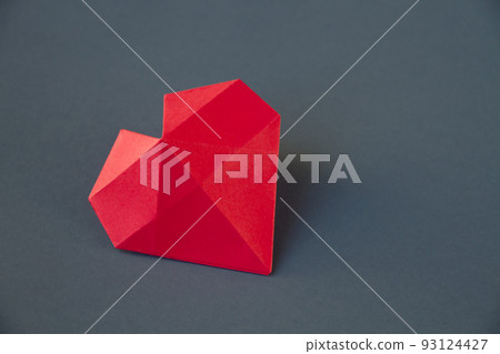 Red paper heart origami isolated on a grey background 93124427