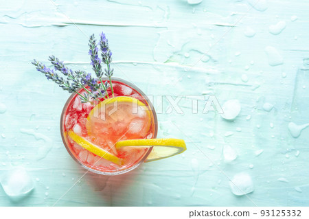 Fresh summer cocktail or mocktail with lemon and lavender, a cold citrus drink Fresh summer cocktail or mocktail with lemon and lavender, a cold citrus drink 93125332