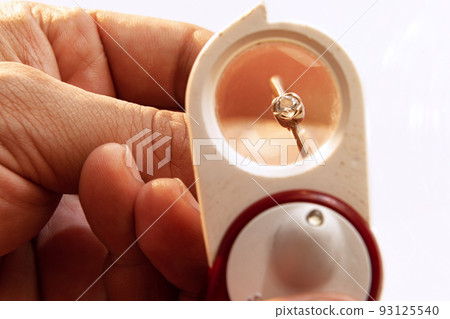 Use of special equipment for watch repair. Closeup watchmaker's hands with work tools. Concept of vintage retro mechanisms, job, work, ad 93125540