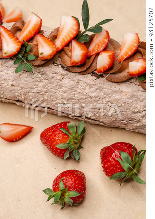 Homemade strawberry cake roll with cream cheese 93125702