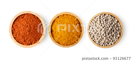 Crushed red chili pepper Turmeric powder in wood bowl isolated on white 93126677