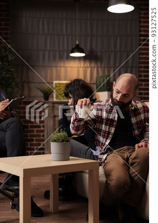 Partners sitting back to back fighting at couple therapy session with counselor, trying to solve relationship problems and conflict. Giving professional advice to save marriage. Partners sitting back to back fighting at couple therapy session with counselor, trying to solve relationship problems and conflict. Giving professional advice to save marriage. 93127525