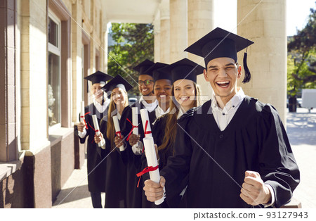 Happy excited university graduates rejoice in successful completion of their studies. Happy excited university graduates rejoice in successful completion of their studies. 93127943
