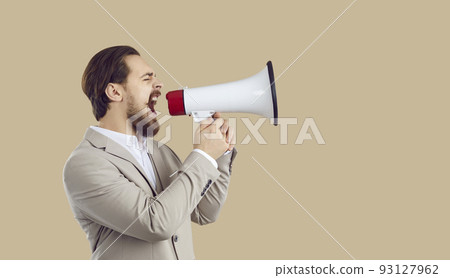 Businessman making job announcement and shouting through megaphone on copy space background 93127962