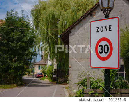 The road speed sign , village background The road speed sign , village background 93128348