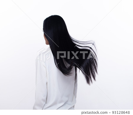 Black Straight Long Black Hair woman throw fly in air with fashion stylish and fun joy. Female turn back wear white shirt express emotion happy by blow wind hair, isolated white background Black Straight Long Black Hair woman throw fly in air with fashion stylish and fun joy. Female turn back wear white shirt express emotion happy by blow wind hair, isolated white background 93128648