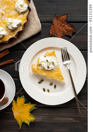 A piece of homemade pumpkin pie and a cup of tea A piece of homemade pumpkin pie and a cup of tea 93131394