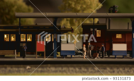 Model train at model railroad. People at miniature railway station. Model railway exhibition. 93131873