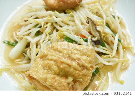 fried bean sprout with slice egg tofu and chop pork in plate on table 93132141