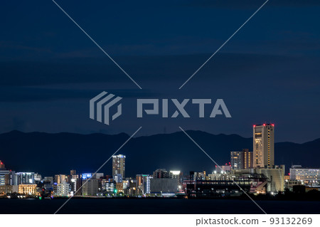 Kitakyushu cityscape in the summer night sky seen from Shimonoseki over the Kanmon Straits 93132269