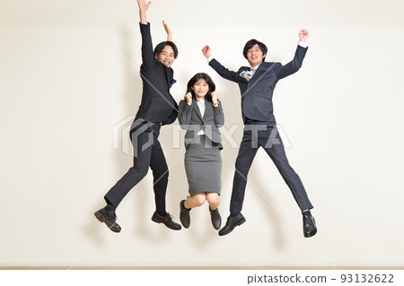 Three young business people jumping Three young business people jumping 93132622