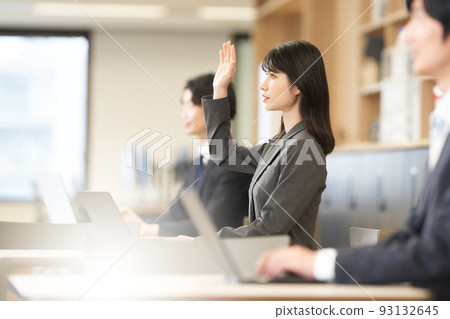 Profile of a young business woman speaking at a seminar 93132645