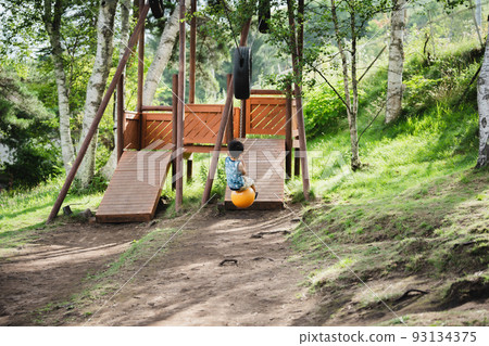 Kids playing with zipline 93134375