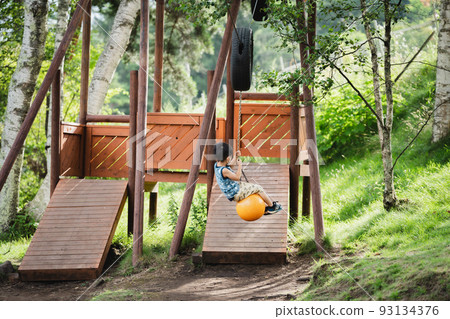 Kids playing with zipline 93134376