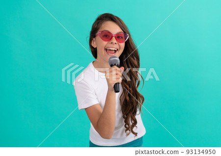 Music is what I am. Happy child sing song. Karaoke and live music. Girl singer hold microphone Music is what I am. Happy child sing song. Karaoke and live music. Girl singer hold microphone 93134950