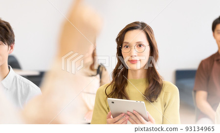 Young woman attending a seminar Young woman attending a seminar 93134965