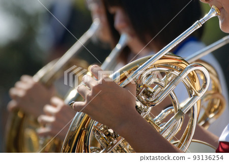 girl blowing horn outdoors girl blowing horn outdoors 93136254