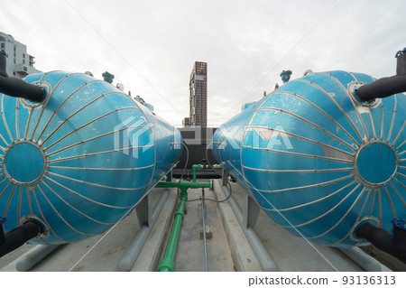 Chiller tower or cooling tower on rooftop of a office building in urban city. System work. Architecture machine. Condenser Water Supply and Condenser Water Return pipe lines. Ventilation compressor. Chiller tower or cooling tower on rooftop of a office building in urban city. System work. Architecture machine. Condenser Water Supply and Condenser Water Return pipe lines. Ventilation compressor. 93136313