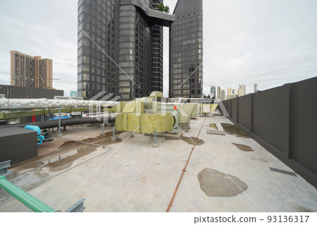 Chiller tower or cooling tower on rooftop of a office building in urban city. System work. Architecture machine. Condenser Water Supply and Condenser Water Return pipe lines. Ventilation compressor. Chiller tower or cooling tower on rooftop of a office building in urban city. System work. Architecture machine. Condenser Water Supply and Condenser Water Return pipe lines. Ventilation compressor. 93136317