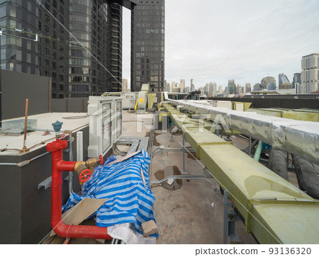 Chiller tower or cooling tower on rooftop of a office building in urban city. System work. Architecture machine. Condenser Water Supply and Condenser Water Return pipe lines. Ventilation compressor. Chiller tower or cooling tower on rooftop of a office building in urban city. System work. Architecture machine. Condenser Water Supply and Condenser Water Return pipe lines. Ventilation compressor. 93136320