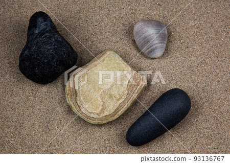 Stones and Small Rocks on a Sandy Coastal Beach Stones and Small Rocks on a Sandy Coastal Beach 93136767