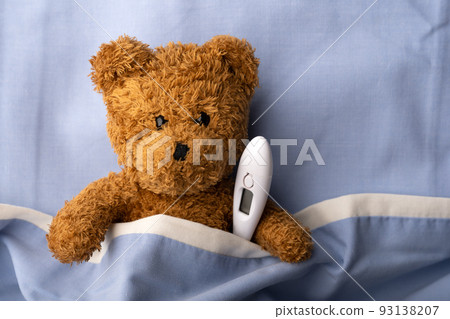 Sick teddy bear on hospital bed Sick teddy bear on hospital bed 93138207