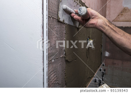 adhesive, architecture, bathroom, bathroom renovation, builder, building, cement, ceramic tile laying, ceramic wall tiles, concrete, construction, construction worker, contractor, cuts tile, decoratio 93139343