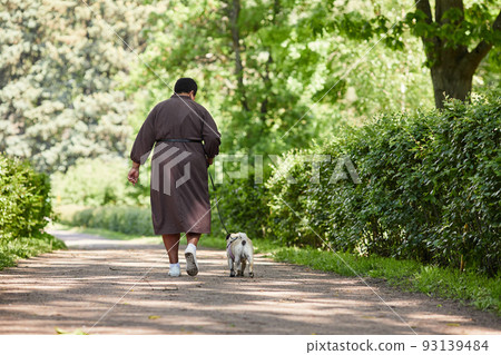Woman with Dog walking Together Woman with Dog walking Together 93139484