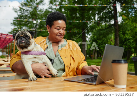 Woman with Dog in Outdoor Cafe Woman with Dog in Outdoor Cafe 93139537